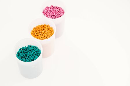 Plastic granules close up for holding,Colorful plastic granules with white background. and dollar money,Plastic Business,Plastic industry.の写真素材