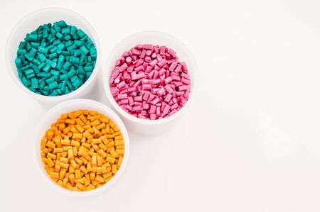 Plastic granules close up for holding,Colorful plastic granules with white background. and dollar money,Plastic Business,Plastic industry.の写真素材