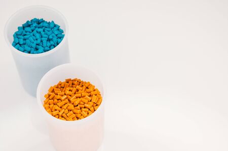 Plastic granules close up for holding,Colorful plastic granules with white background. and dollar money,Plastic Business,Plastic industry.の写真素材