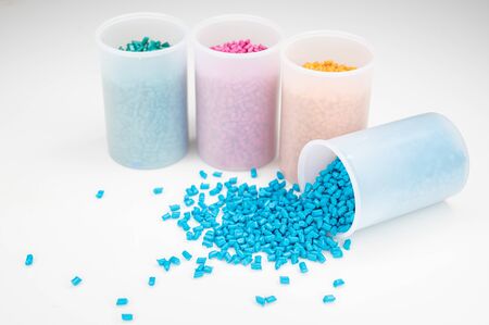 Plastic granules close up for holding,Colorful plastic granules with white background. and dollar money,Plastic Business,Plastic industry.の写真素材