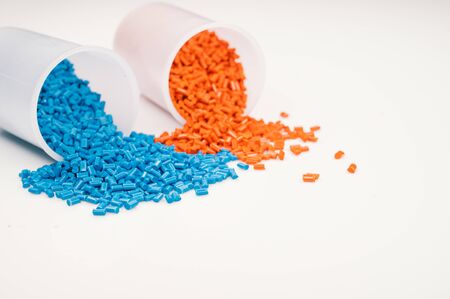 Plastic granules close up for holding,Colorful plastic granules with white background. and dollar money,Plastic Business,Plastic industry.の写真素材