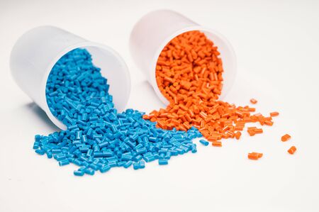 Plastic granules close up for holding,Colorful plastic granules with white background. and dollar money,Plastic Business,Plastic industry.の写真素材