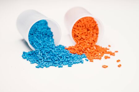 Plastic granules close up for holding,Colorful plastic granules with white background. and dollar money,Plastic Business,Plastic industry.の写真素材