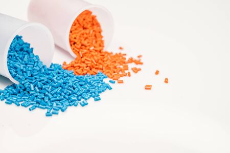 Plastic granules close up for holding,Colorful plastic granules with white background. and dollar money,Plastic Business,Plastic industry.の写真素材