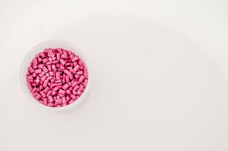Plastic granules close up for holding,Colorful plastic granules with white background. and dollar money,Plastic Business,Plastic industry.の写真素材