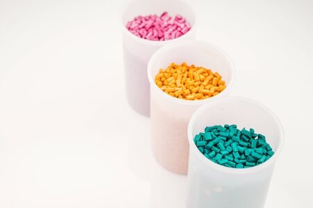 Plastic granules close up for holding,Colorful plastic granules with white background. and dollar money,Plastic Business,Plastic industry.の写真素材
