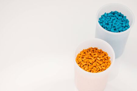 Plastic granules close up for holding,Colorful plastic granules with white background. and dollar money,Plastic Business,Plastic industry.の写真素材