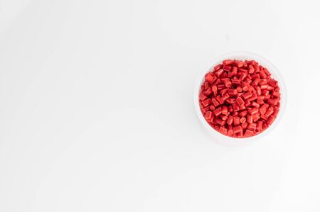 Plastic granules close up for holding,Colorful plastic granules with white background. and dollar money,Plastic Business,Plastic industry.の写真素材