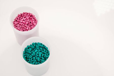Plastic granules close up for holding,Colorful plastic granules with white background. and dollar money,Plastic Business,Plastic industry.の写真素材