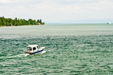 Bodensee, Germany, boat and view to the Alpesの写真素材