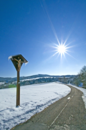 Jesus on cross in wintertimeの写真素材