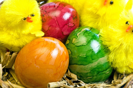 easter basket with painted eggs and biddies