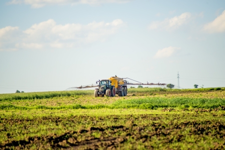 tractor with dung trailerの写真素材