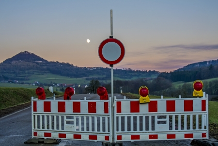 Moon over a traffic signの写真素材
