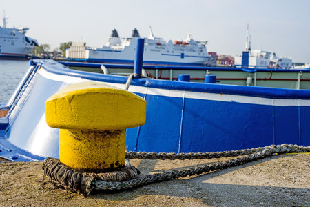 Bollard at a pier with ferryの写真素材