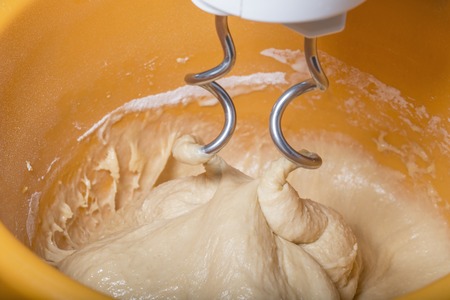 Kneading a dough with a machineの写真素材