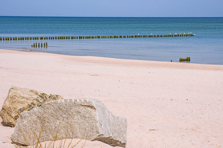 beach of Baltic Sea, Poland with groinsの写真素材