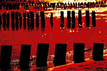 Sunset over the Baltic Sea with groinsの写真素材