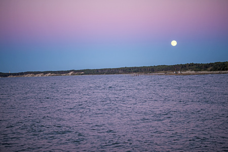 Full moon over the Baltic Seaの写真素材