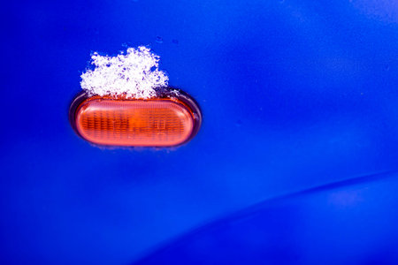 snow on a car light