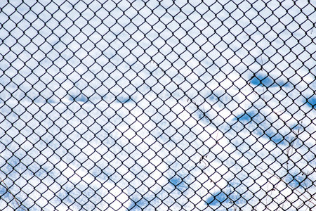 fence with snow in the background