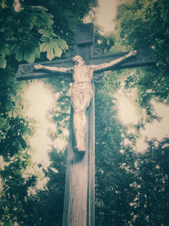 Cross in a forest in retro lookの写真素材