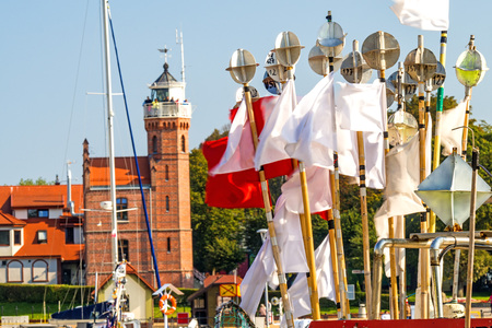 Fishing port of Ustka, Poland with old lighthouseの写真素材
