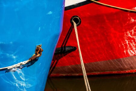ship bows in blue and redの写真素材