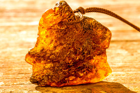 Amber in sun with inclusionsの写真素材