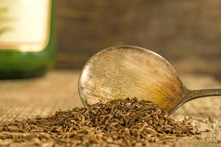 Caraway, spice and medicine on a spoonの写真素材