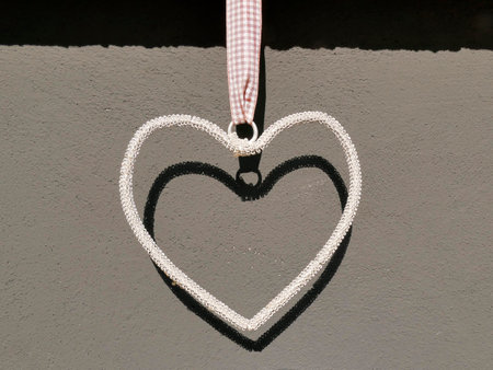Heart on a gray and black wallの写真素材