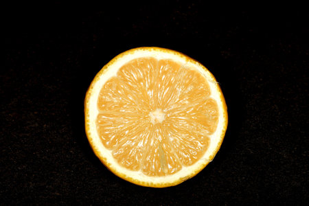 lemon cut on a black undergroundの写真素材
