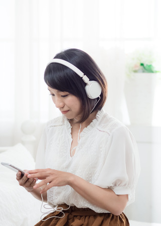 Young woman listening to the musicの写真素材