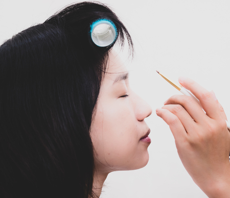 Young woman with makeup cosmeticsの写真素材
