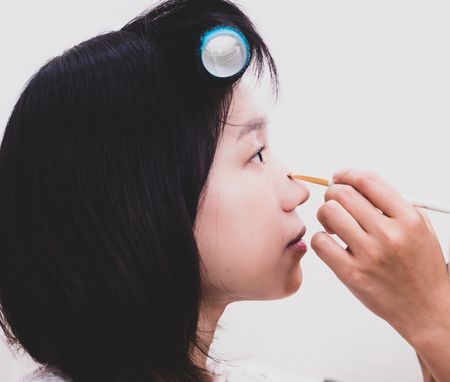 Young woman with makeup cosmeticsの写真素材