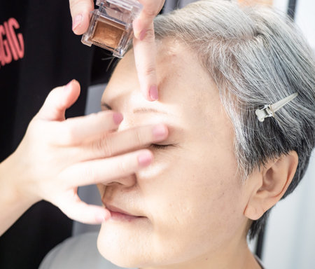Senior asian woman and make up artist.