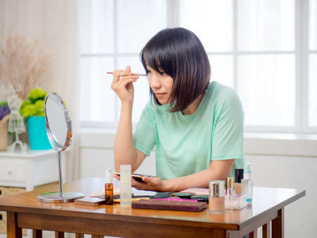 Young girl with makeup cosmeticsの写真素材