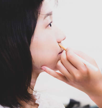 Young girl with makeup cosmeticsの写真素材