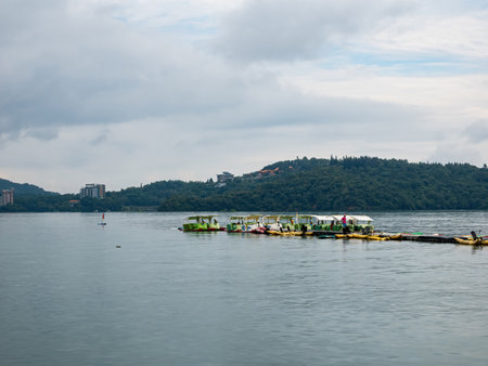 SUN MOON LAKE,TAIWAN - JUNE 10: many boats parking at the pier on June 10, 2023 at Sun Moon Lake, Taiwan. Sun Moon Lake is the largest body of water in Taiwan as well as a tourist attraction.のeditorial素材