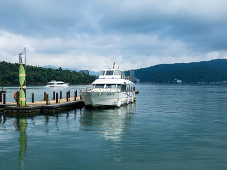 SUN MOON LAKE,TAIWAN - JUNE 10: many boats parking at the pier on June 10, 2023 at Sun Moon Lake, Taiwan. Sun Moon Lake is the largest body of water in Taiwan as well as a tourist attraction.のeditorial素材