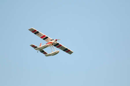 Radio controlled float plane flying overhead.のeditorial素材