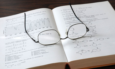 chemistry book and eyesglass