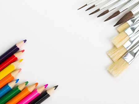 Colorful pencils and brushes on a whiteの写真素材