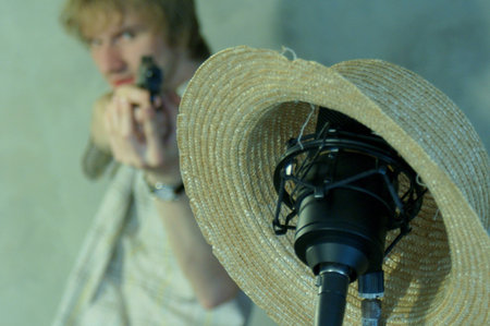 Young music man with gun