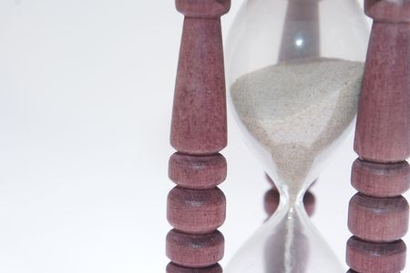 Small wooden egg timer in white backgroundの写真素材