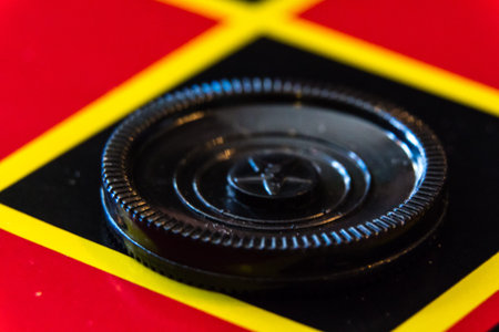 Checker game piece on a checkerboard square