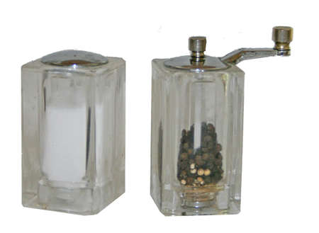 Clear plastic salt shaker and pepper millの写真素材