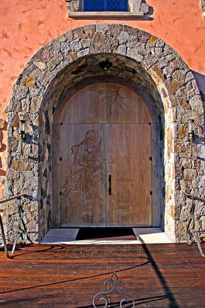 A beautifully carved wooden doorの写真素材