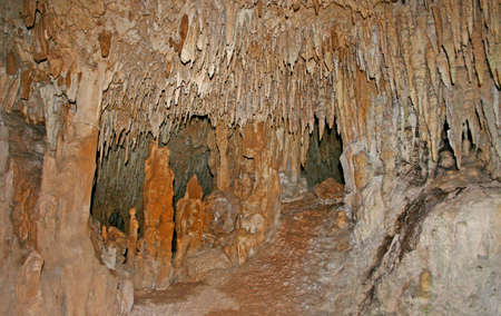 Stalactites and Stalagmites and a Cenote in Aktun Chen, Mexicoの写真素材