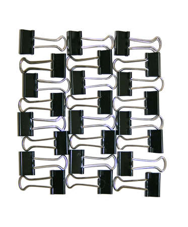 an assortment of black binder or paper clipsの写真素材